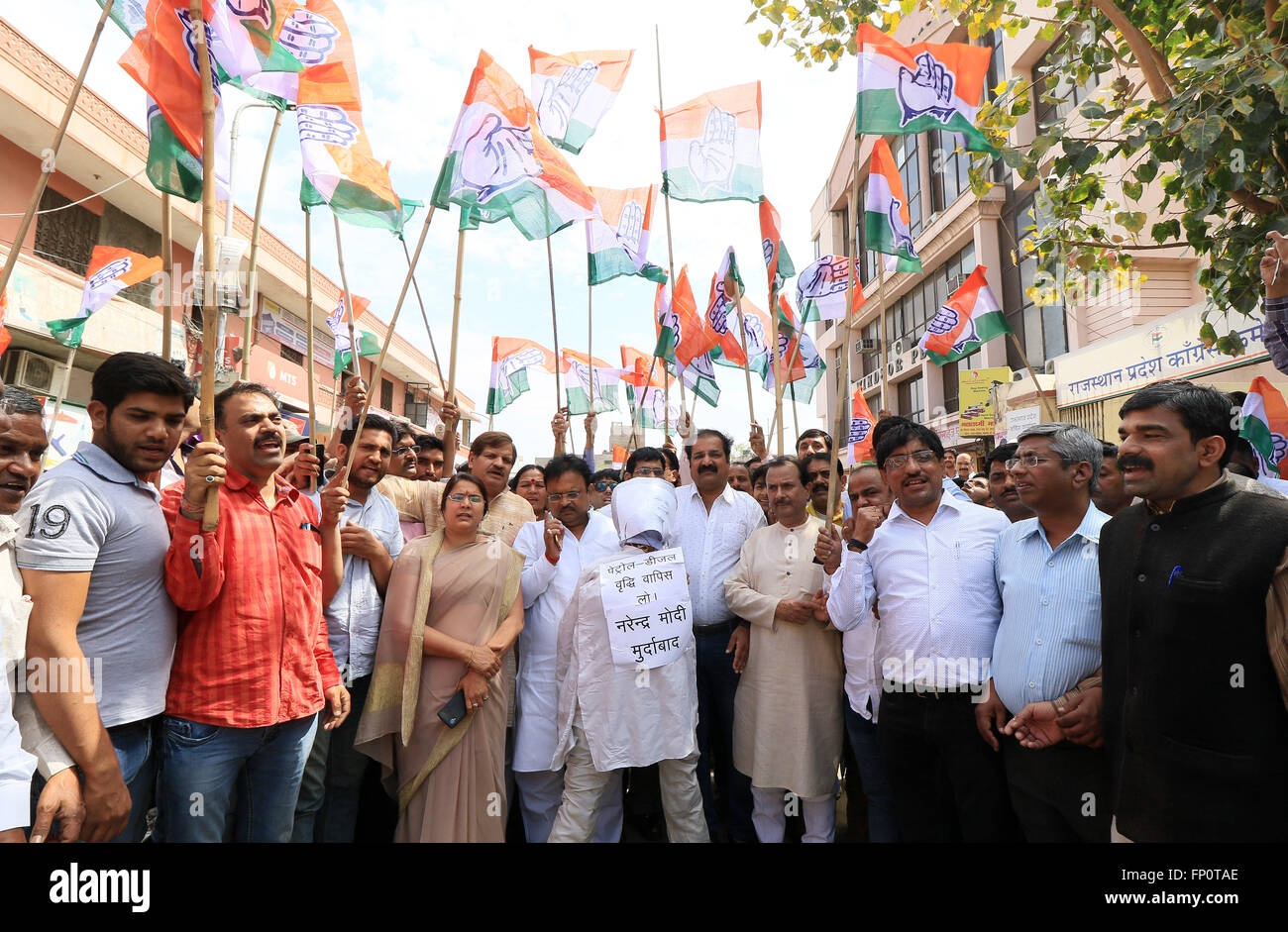 India's main oppostion party ' Congress' activists with an effigy of Prime Minister Narendra Modi during their protest against the hike in petrol and diesel prices, in Jaipur on17 march, 2016.Oil marketing companies on 16 march 2016 increased the prices of petrol by Rs 3.07 per litre while it hiked the prices of diesel by Rs 1.90.(Photo By Vishal Bhatnagar/ Pacific Press) Stock Photo