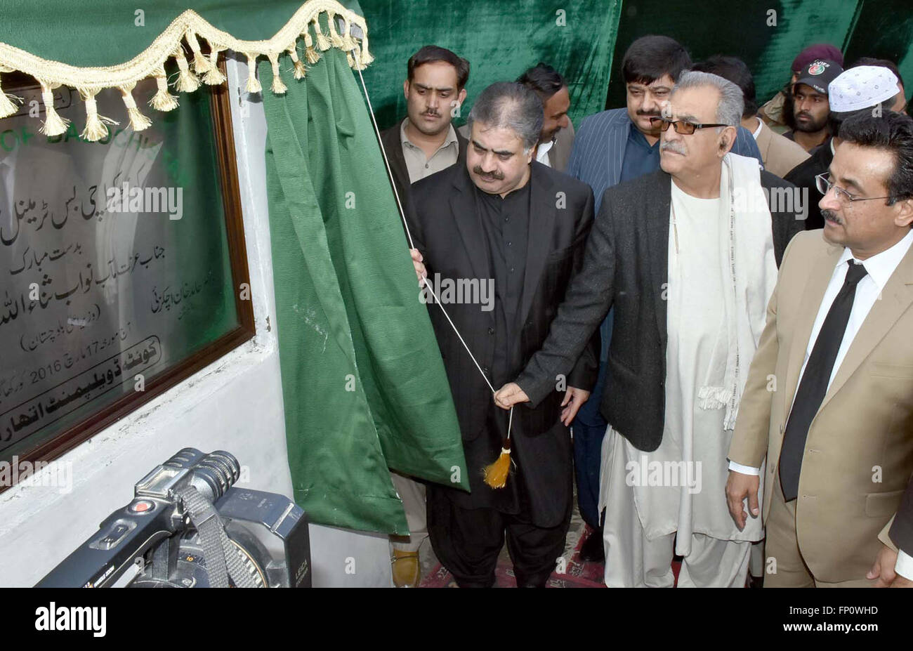 Chief Minister Balochistan Sana Ullah Zehri unveiling plaque during Hazar Ganji Bus Terminal inaugural ceremony, held in Quetta on Thursday, March 17, 2016. Stock Photo