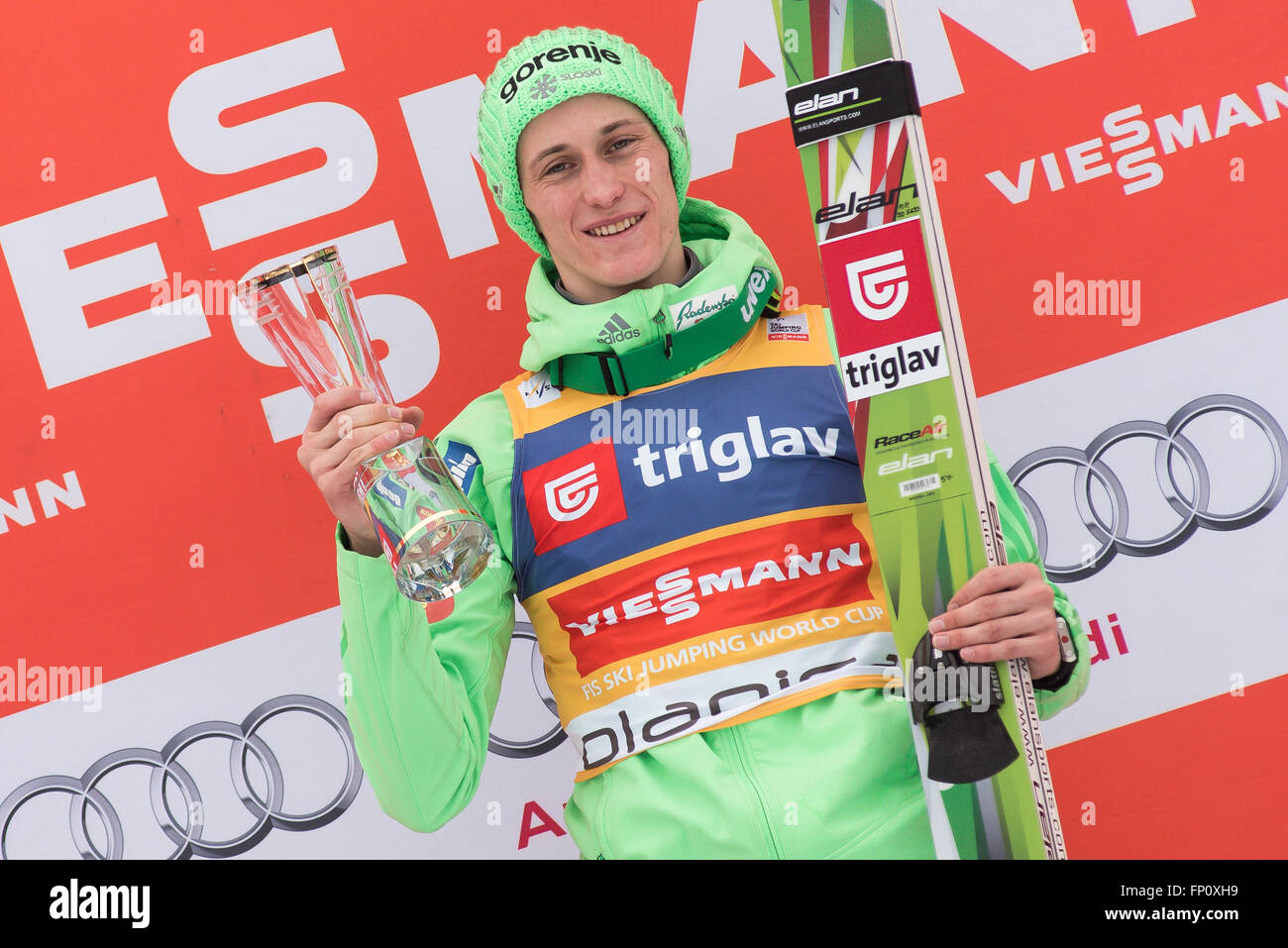 Planica, Slovenia. 17th Mar, 2016. Peter Prevc of Slovenia with trophy on podium celebrating his fist place at the Planica FIS Ski Jumping World Cup final in Planica, Slovenia on March 17, 2016. © Rok Rakun/Pacific Press/Alamy Live News Stock Photo