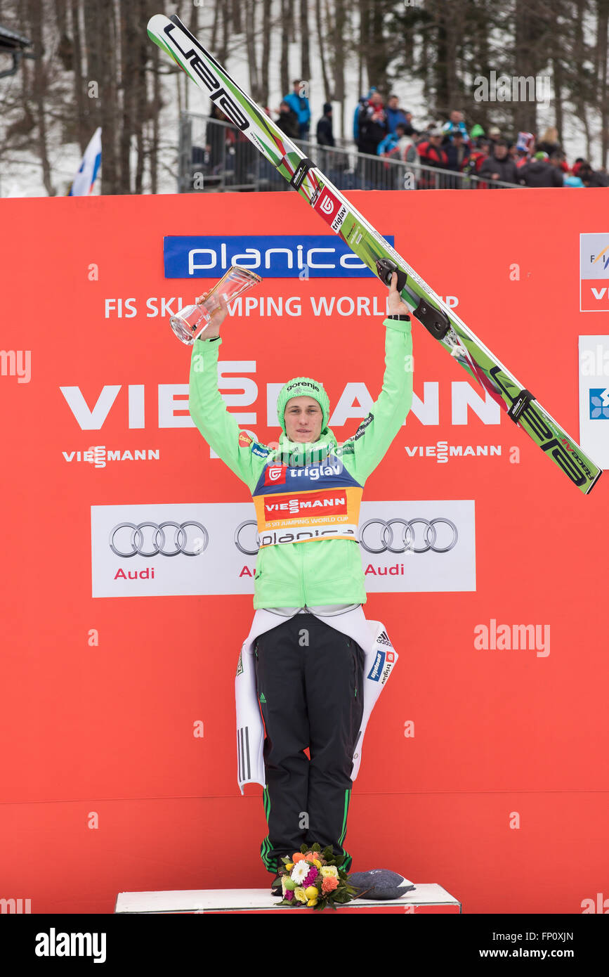 Planica, Slovenia. 17th Mar, 2016. Peter Prevc of Slovenia with trophy on podium celebrating his fist place at the Planica FIS Ski Jumping World Cup final in Planica, Slovenia on March 17, 2016. © Rok Rakun/Pacific Press/Alamy Live News Stock Photo