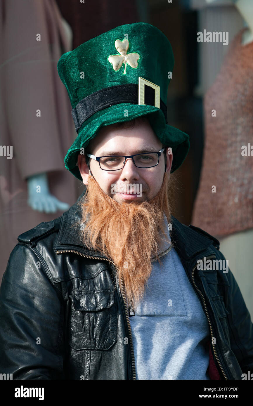 Belfast, Ireland. 17th March, 2016. A man with a Leprechaun hat and