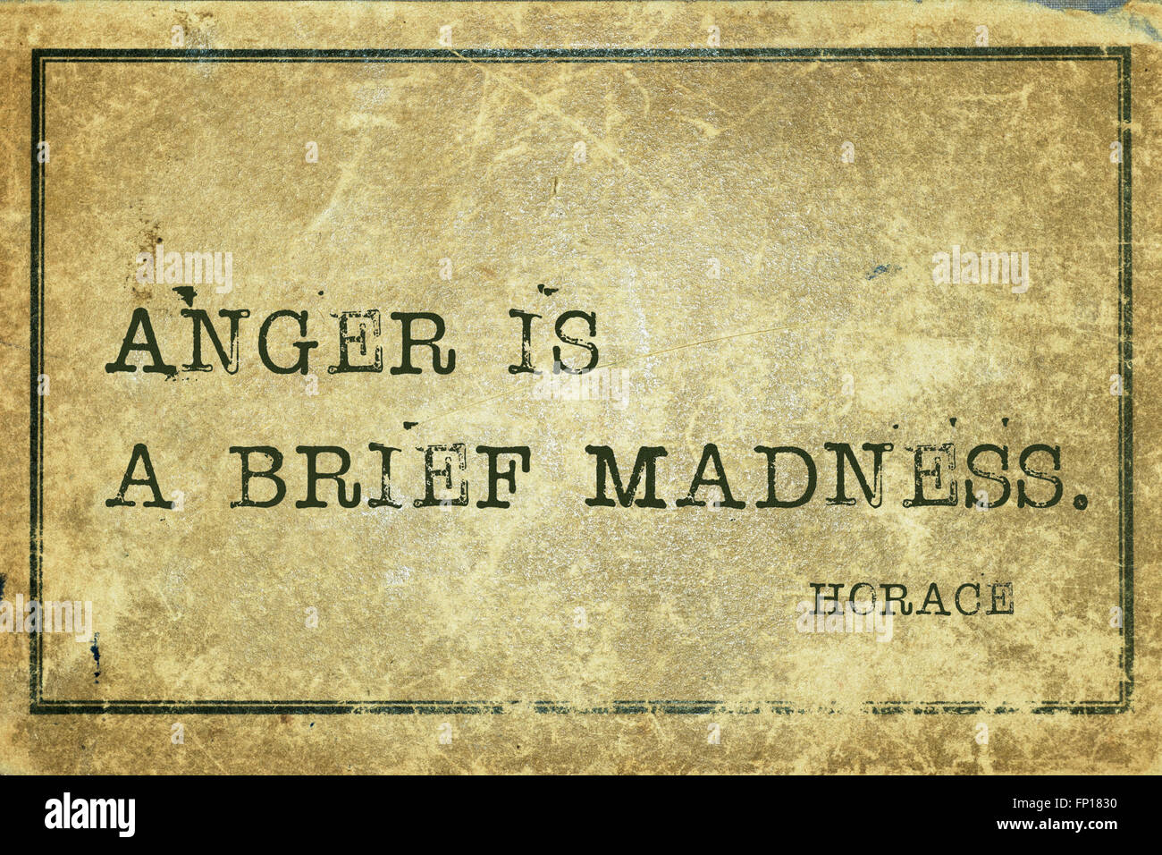 Anger is a brief madness - ancient Roman poet Horace quote printed on grunge vintage cardboard Stock Photo