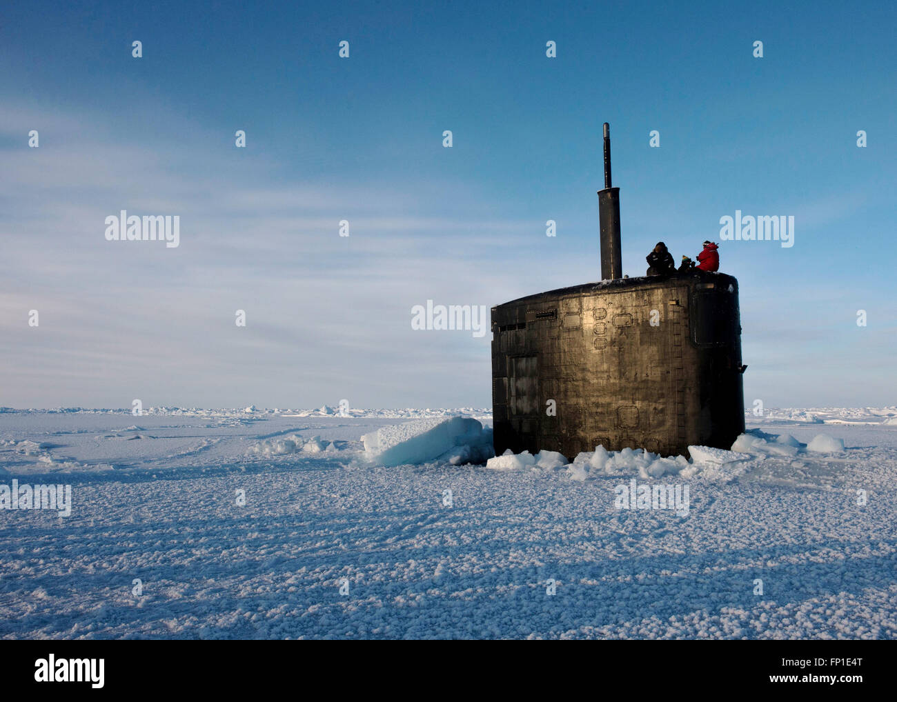 U.S Navy Virginia-class nuclear attack submarine USS Hampton surfaces through the arctic ice during training exercise ICEX 2016 March 14, 2016 in the Arctic Circle. Stock Photo