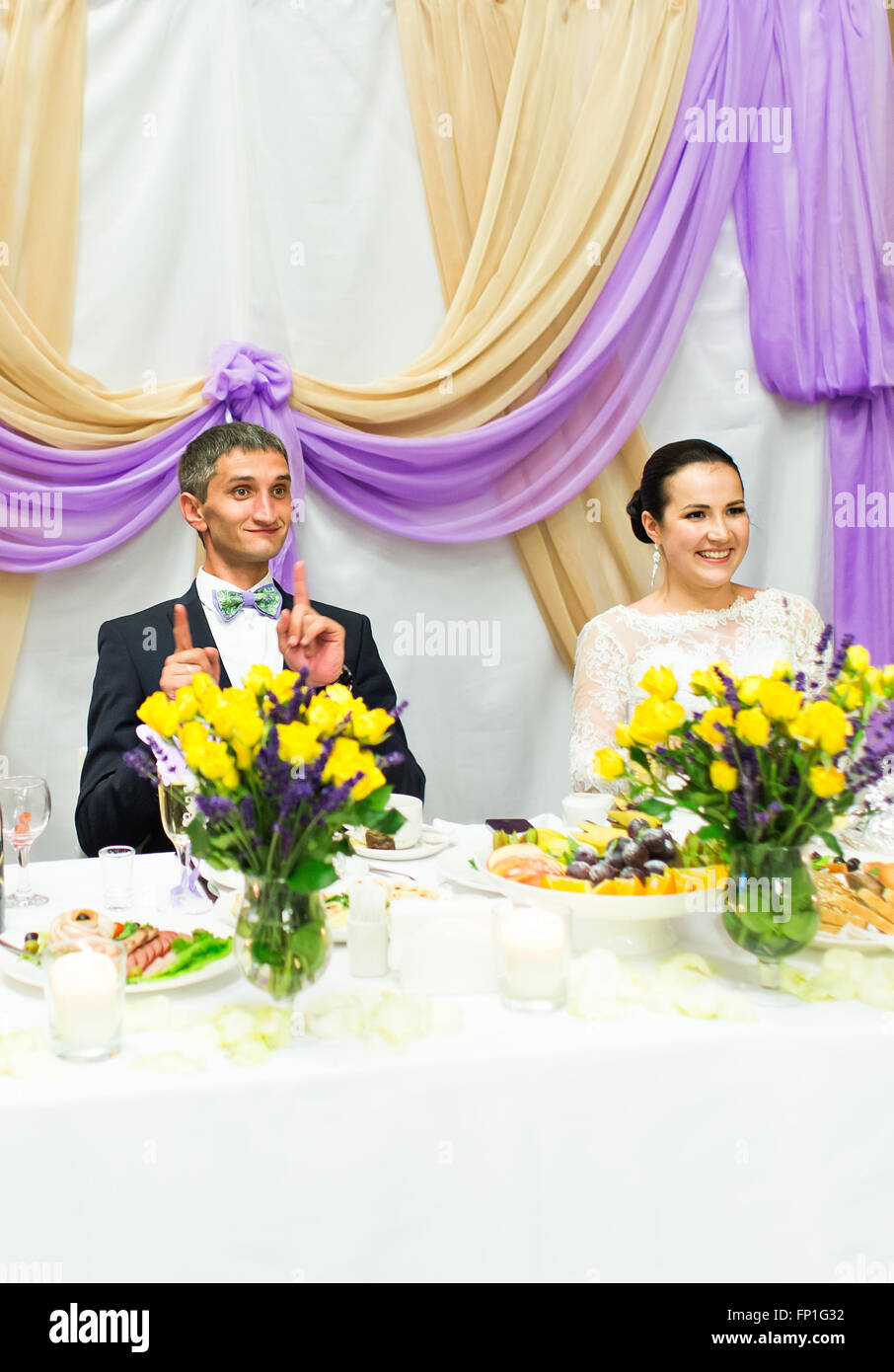 Bride And Groom Enjoying Meal At Wedding Reception Stock Photo - Alamy