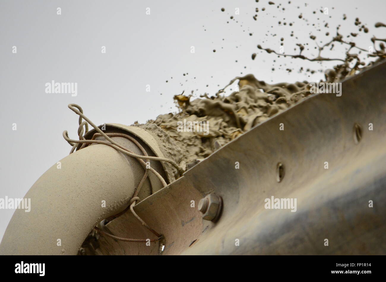 Pipe pumping liquid concrete Stock Photo Alamy