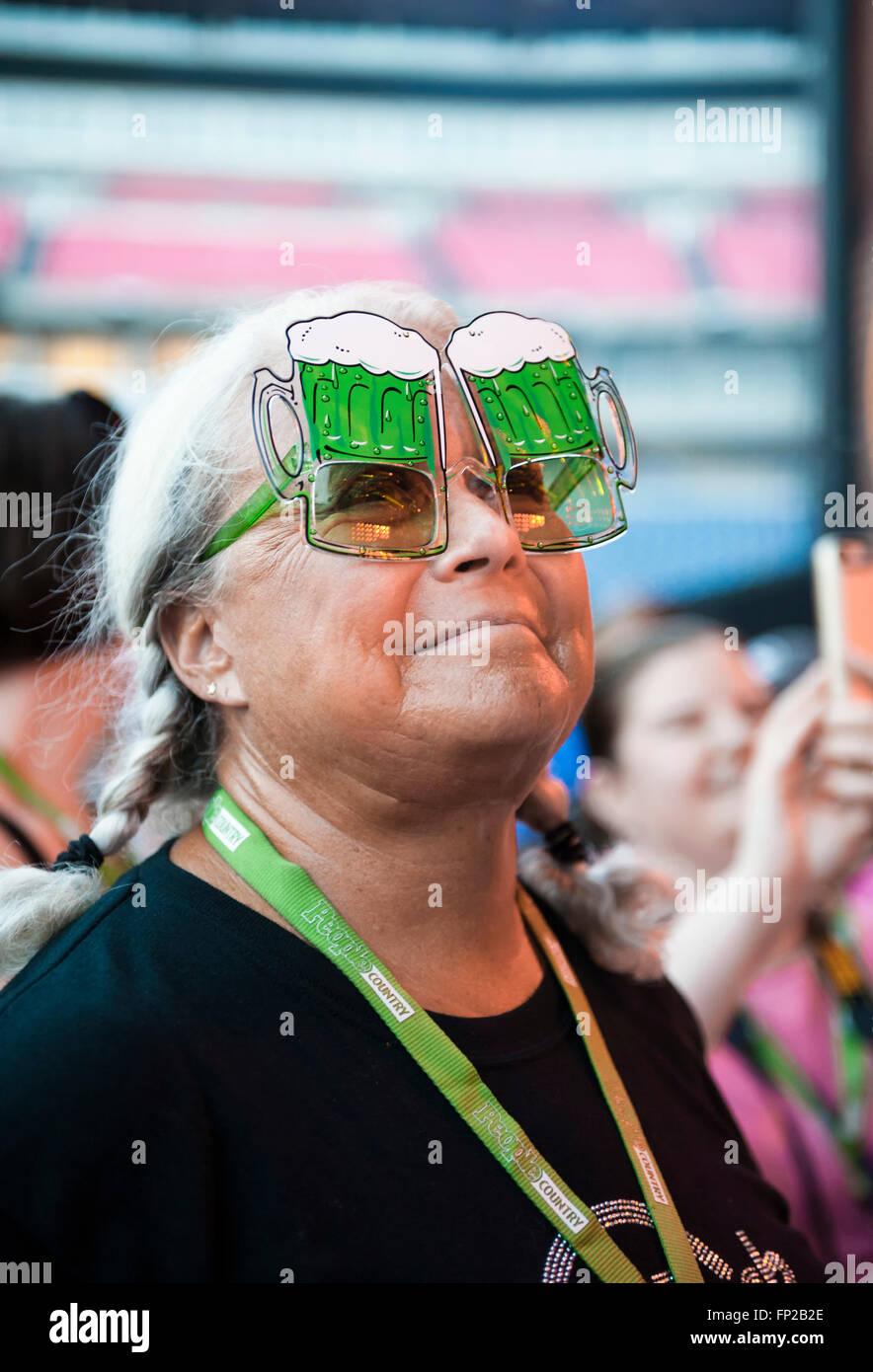 A woman wearing beer glasses (goggles) at the CMA Music Festival in Nashville Tennessee Stock Photo