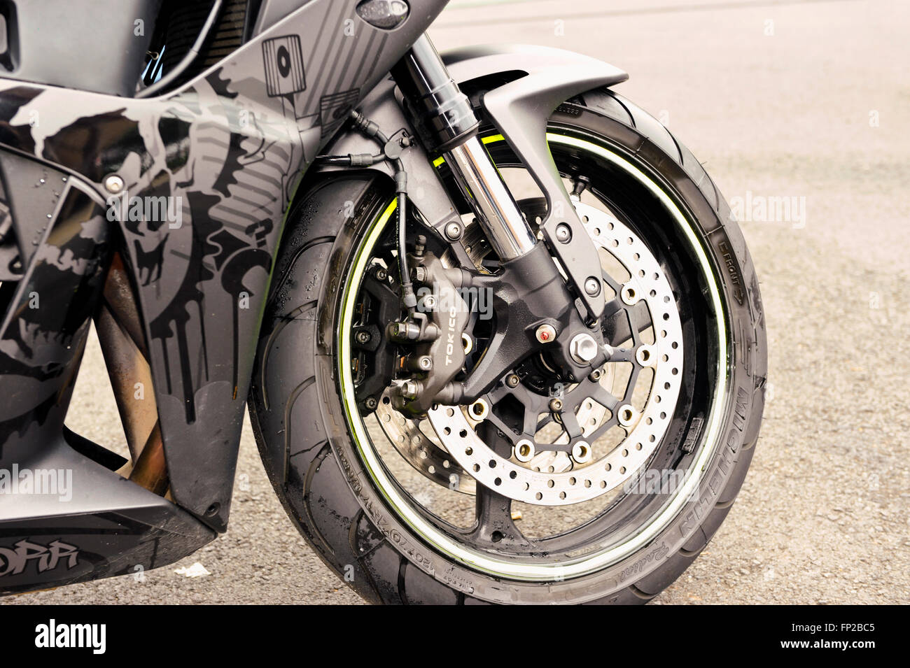 Front tire and disc brake system detail on a sport bike motorcycle Stock Photo