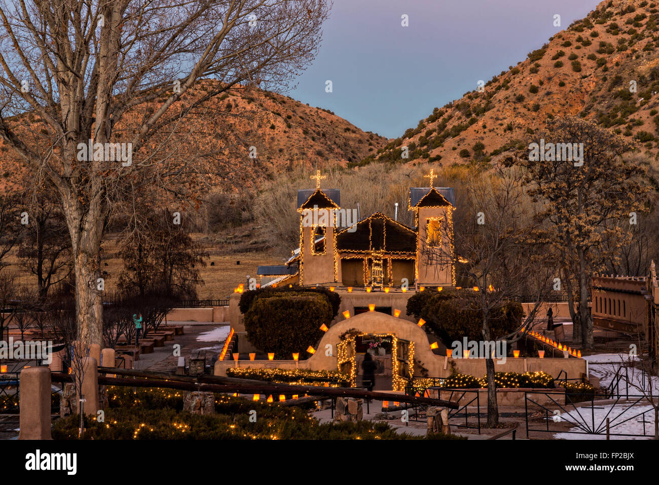 El Santuario de Chimayo Historic Site illuminated by hundreds of small paper lanterns known as luminaria to celebrate the holiday season December 13, 2015 in Jemez Springs, New Mexico. Each year 30,000 people make pilgrimages to the shrine. Stock Photo