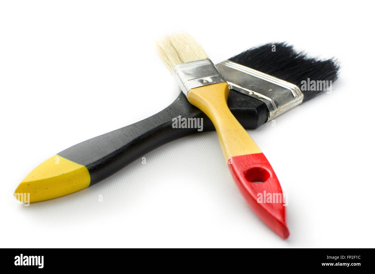 two brushes white background black handle yellow flat bristles Stock Photo