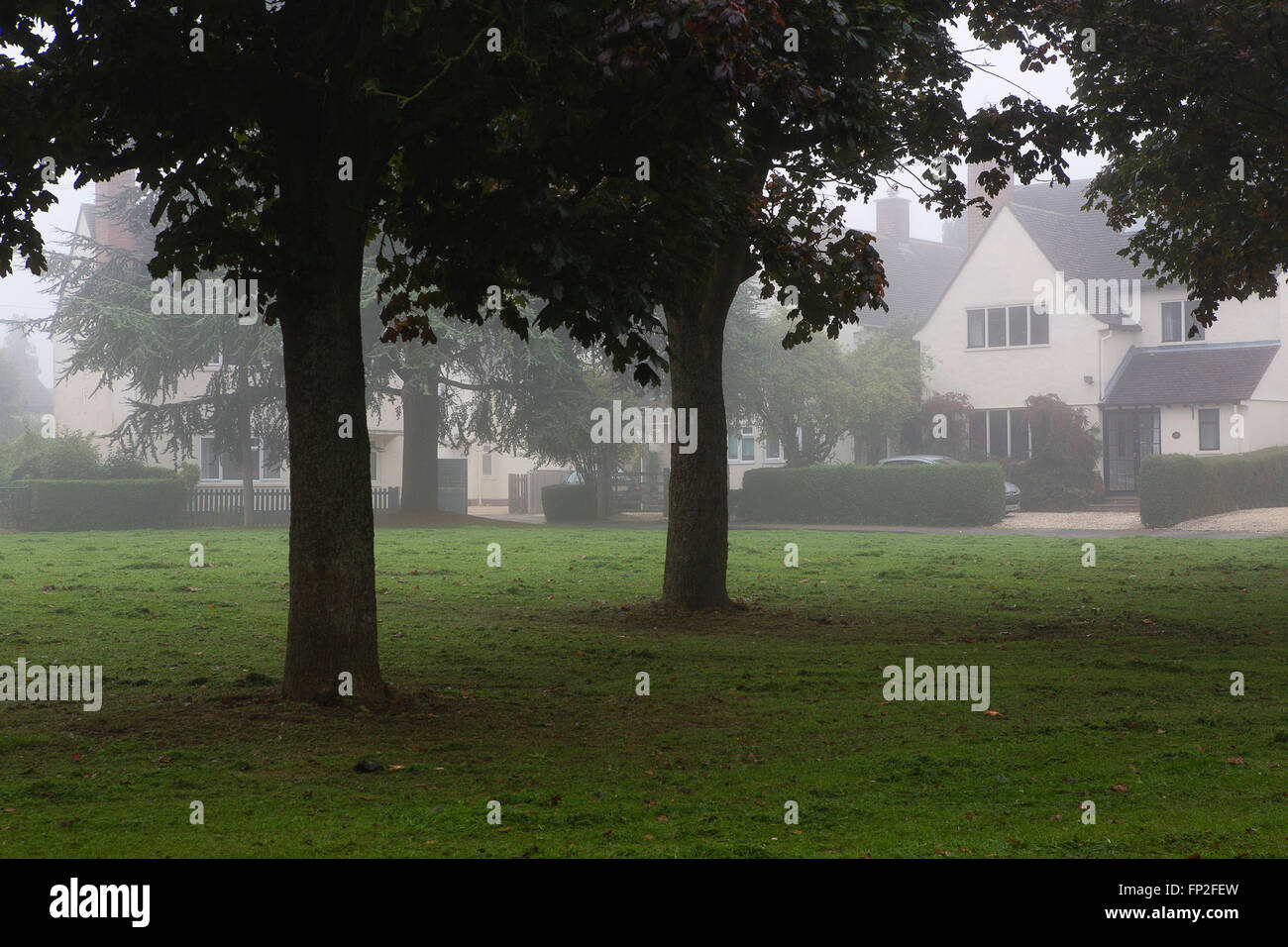 A housing estate in Cirencester in the UK, quite adn empty in the morning mist. Stock Photo