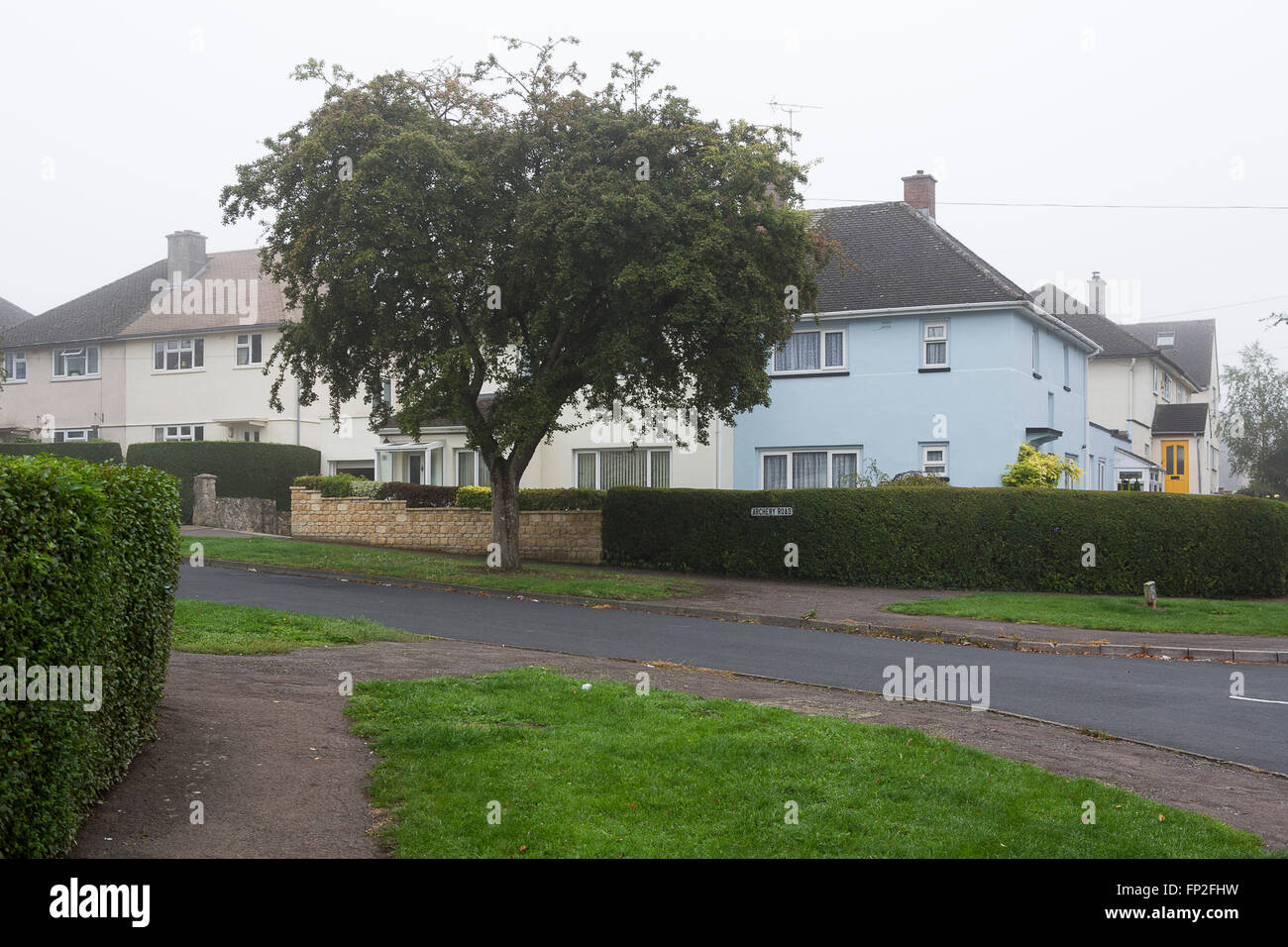A housing estate in Cirencester in the UK, quite adn empty in the morning mist. Stock Photo