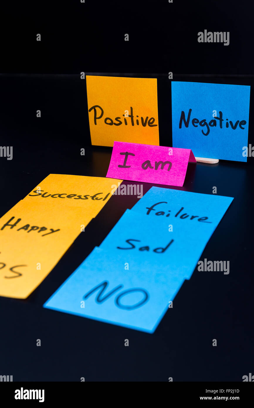 concept of duality using sticky notes with antonyms on a dark background Stock Photo Alamy