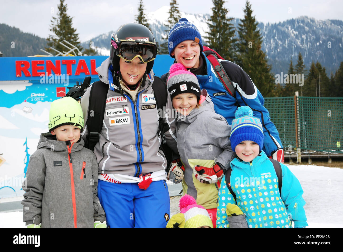 Jasna, LIPTOV, SLOVAKIA - MARCH 05, 2016: Smiling young woman and happy childrens on the slovakian ski resort Jasna. Stock Photo