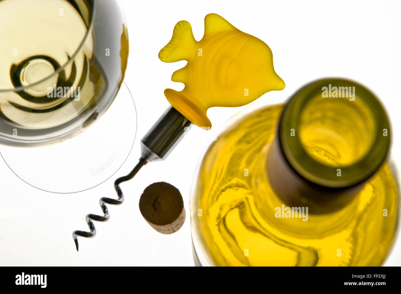 Concept fish & white wine combination with white wine glass, bottle