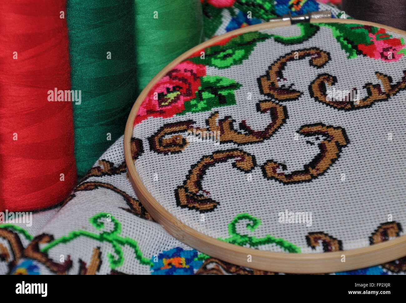 Detail of traditional Ukrainian embroidery towels in the wooden embroidery hoop, cross-stitch Stock Photo