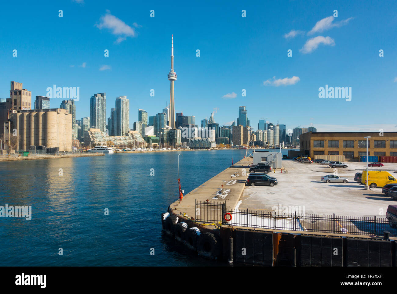 The Toronto skyline from the Billy Bishop Toronto City Airport overlooking the parking lot. Toronto, Ontario, Canada. Stock Photo