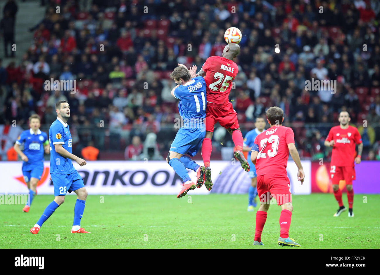 WARSAW, POLAND - MAY 27, 2015: Yevhen Seleznyov of FC Dnipro (L) fights for a ball with Stephane Mbia of FC Sevilla during their UEFA Europa League Final game at Warsaw National Stadium Stock Photo