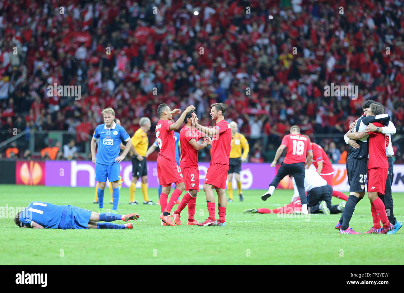 WARSAW, POLAND - MAY 27, 2015: FC Sevilla players (in Red) react after winning UEFA Europa League Final in game against FC Dnipro at Warsaw National Stadium Stock Photo