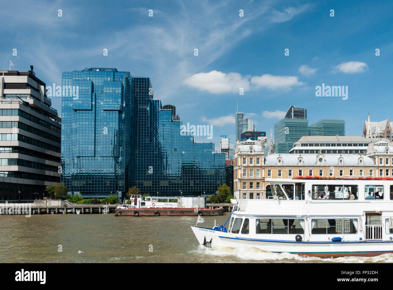 London Thames River cruise passing the Northern and Shell glass building. Stock Photo