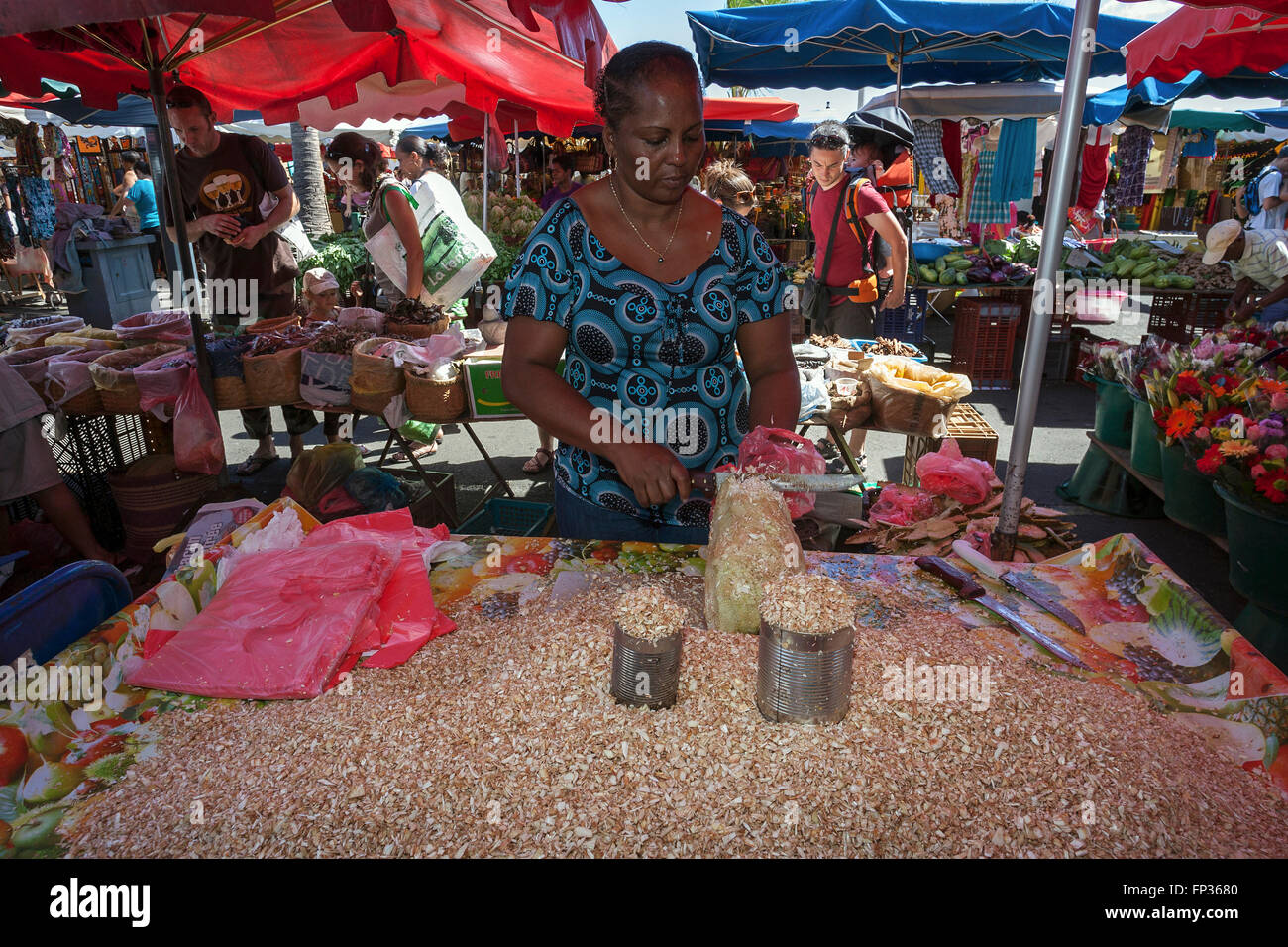 Local woman selling grated breadfruit (Artocarpus altilis), stalls, street markets, Saint Paul, Reunion Stock Photo