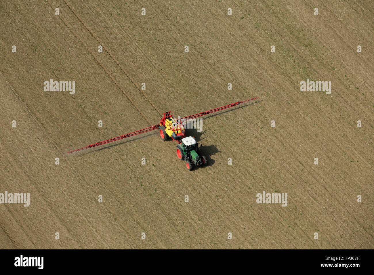 Aerial view, tractor sowing field in spring, agricultural landscape in Mühldorf, Upper Bavaria, Bavaria Stock Photo