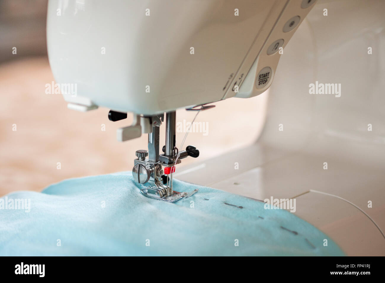 sewing machine working Stock Photo