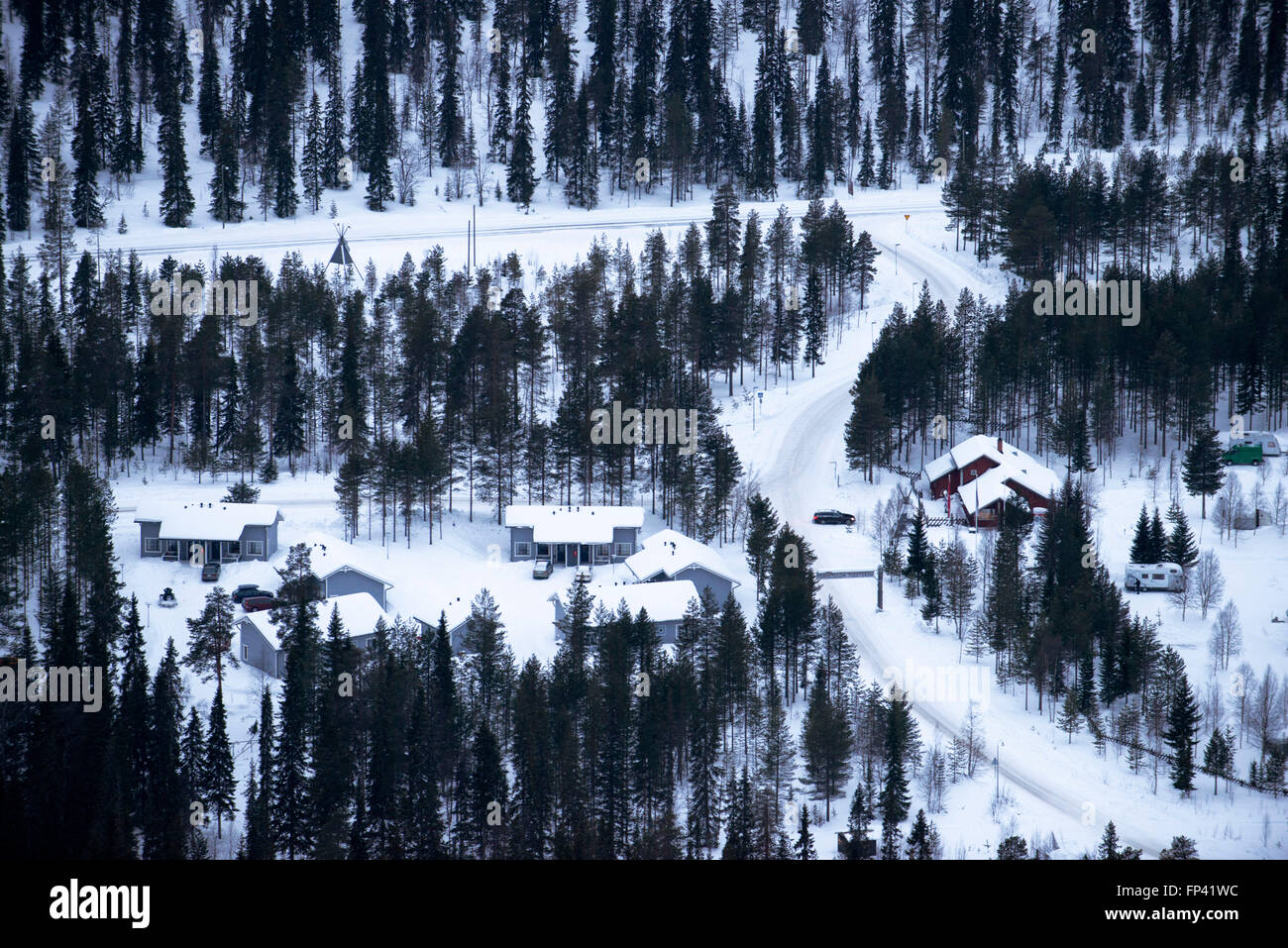Hotels near the Salla ski resort. Deep in the wilderness of heavily snow laden coniferous trees and rugged fell highland, in the Stock Photo