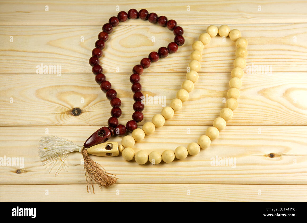 Greek rosaries on wooden background Stock Photo