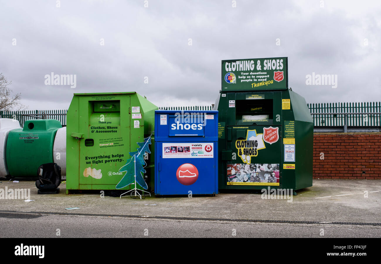 Clothes and Shoe Bank recycling containers in the car park of a Tesco supermarket in Blackpool, Lancashire Stock Photo