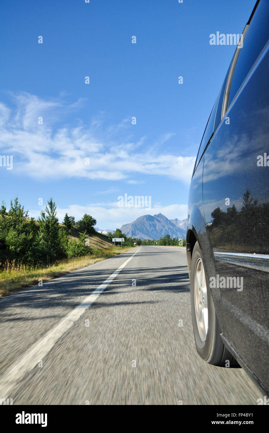 Rear View along the side of a riding car, roadtrip feeling Stock Photo