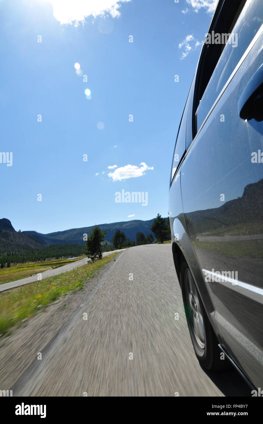 Rear View along the side of a riding car, roadtrip feeling Stock Photo