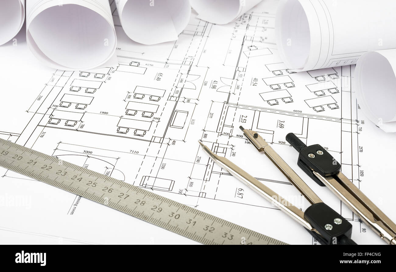 Rolls of blueprints with dividers and ruler. Building concept Stock ...