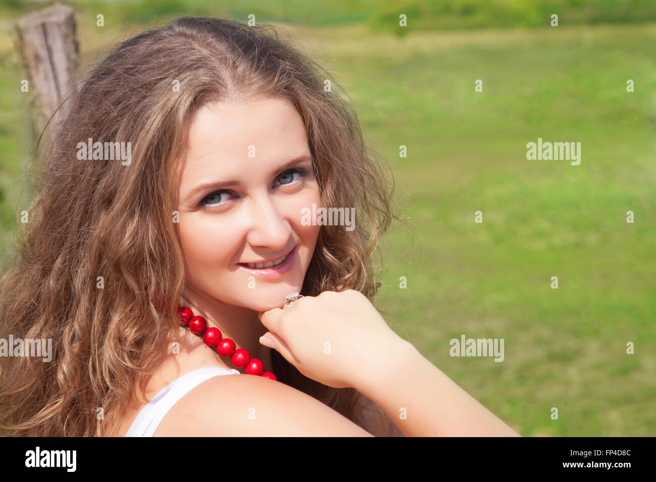 Portrait of a beautiful young woman outdoors in the summer Stock Photo ...