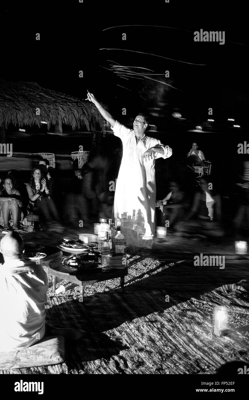 TOURIST WEARING TRADITIONAL EGYPTIAN CLOTHES, DANCING AND ENJOYING