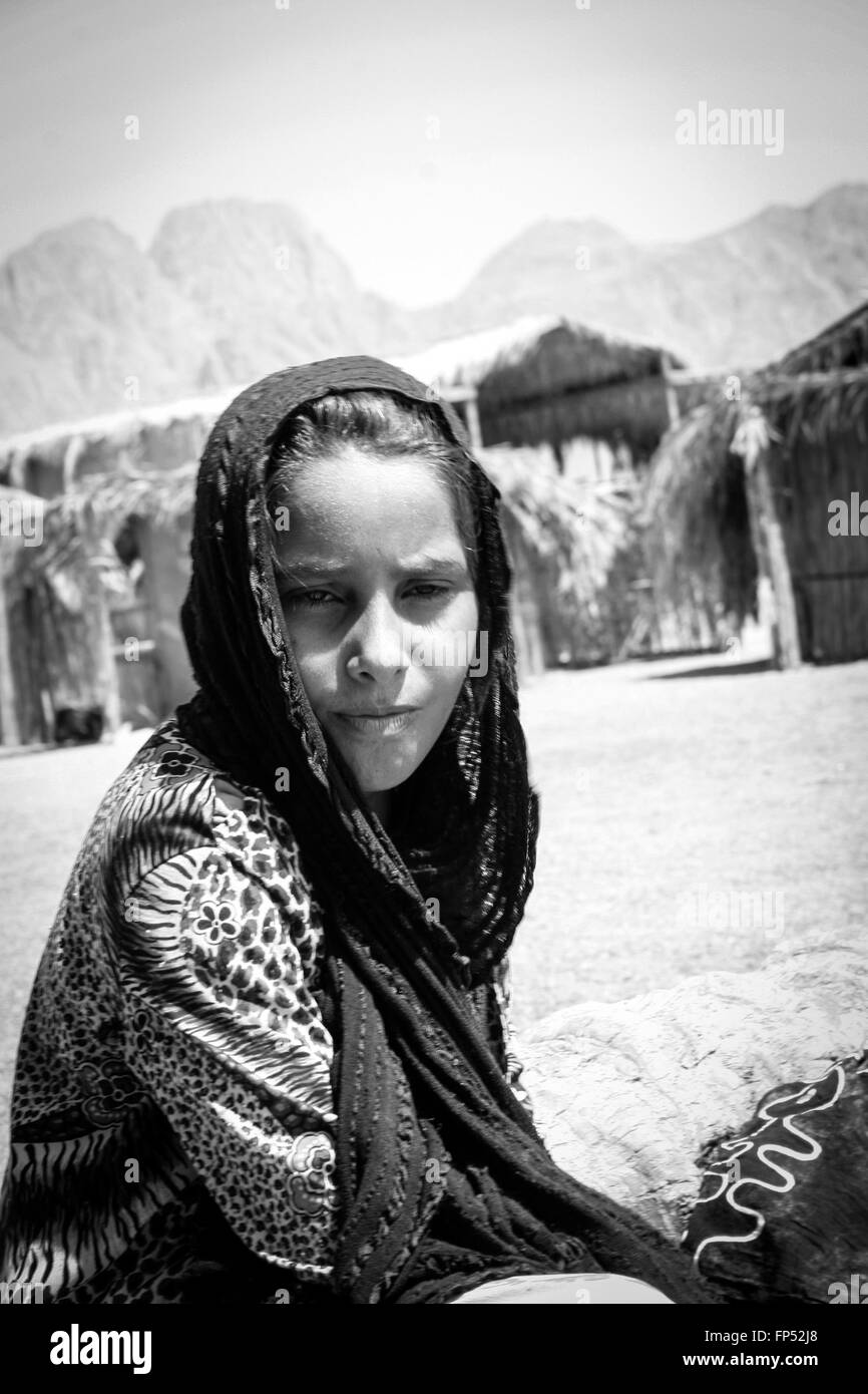 HALF BODY PORTRAIT OF A YOUNG EGYPTIAN GIRL WEARING TRADITIONAL CLOTHES