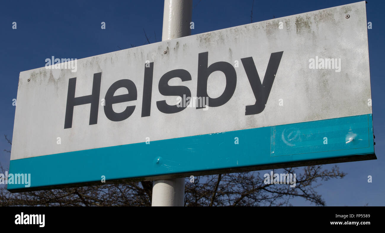 Arriva Trains Wales branded 'Helsby' HSB Railway Station platform sign - Now operated by Transport for Wales Keolis Amey Stock Photo