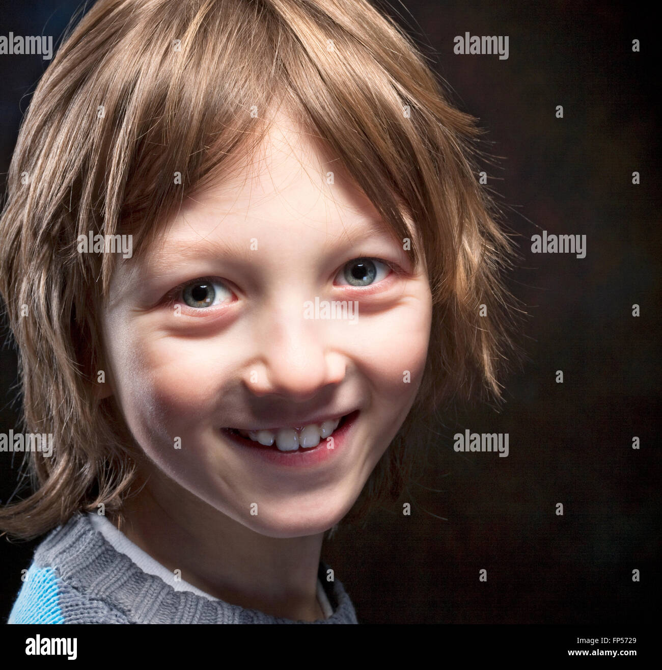 Portrait of a Boy with Blond Hair Smiling Stock Photo - Alamy