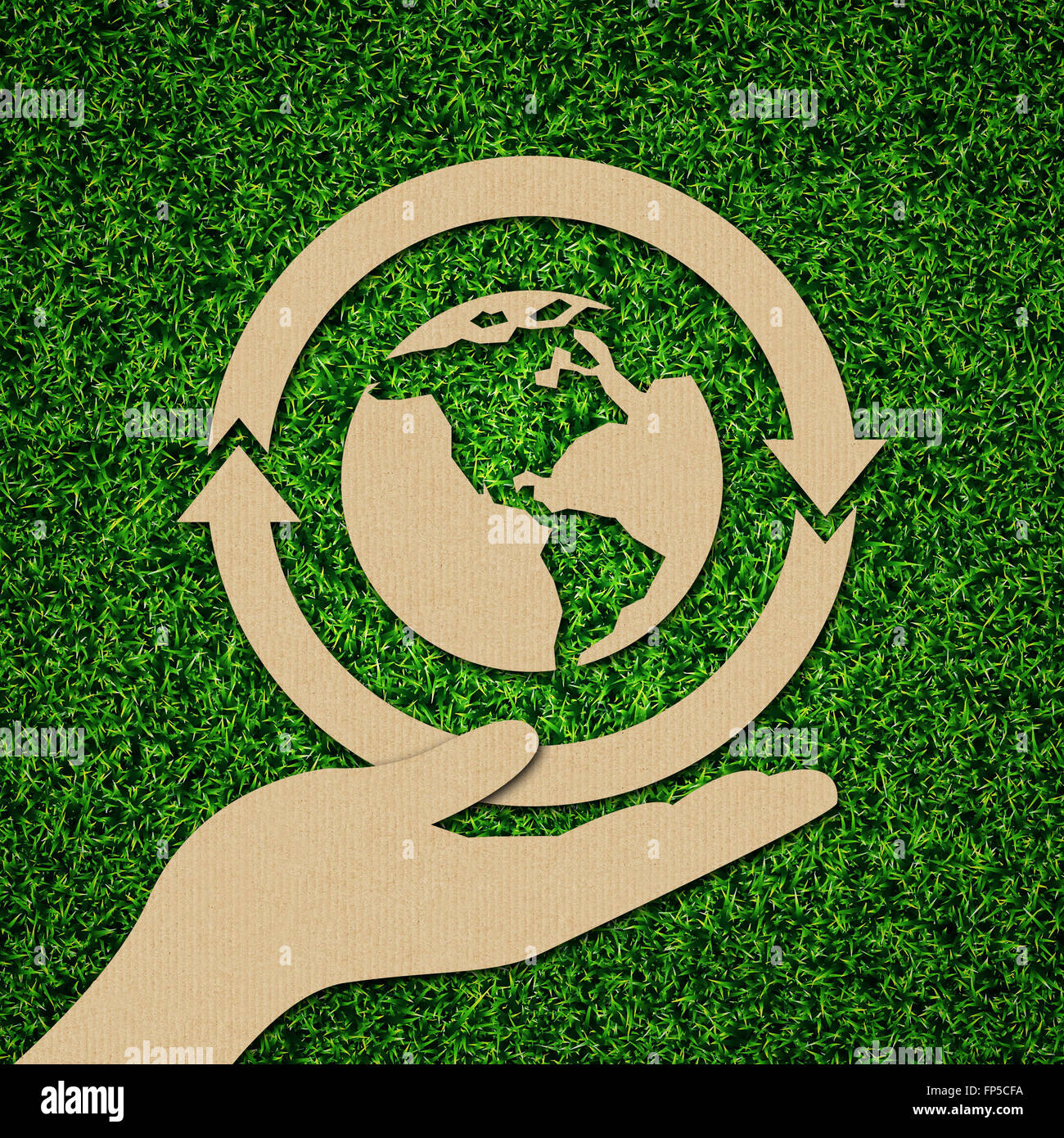 Renewable, sustainable, recycle, and green energy iconic concept on green grass. Stock Photo
