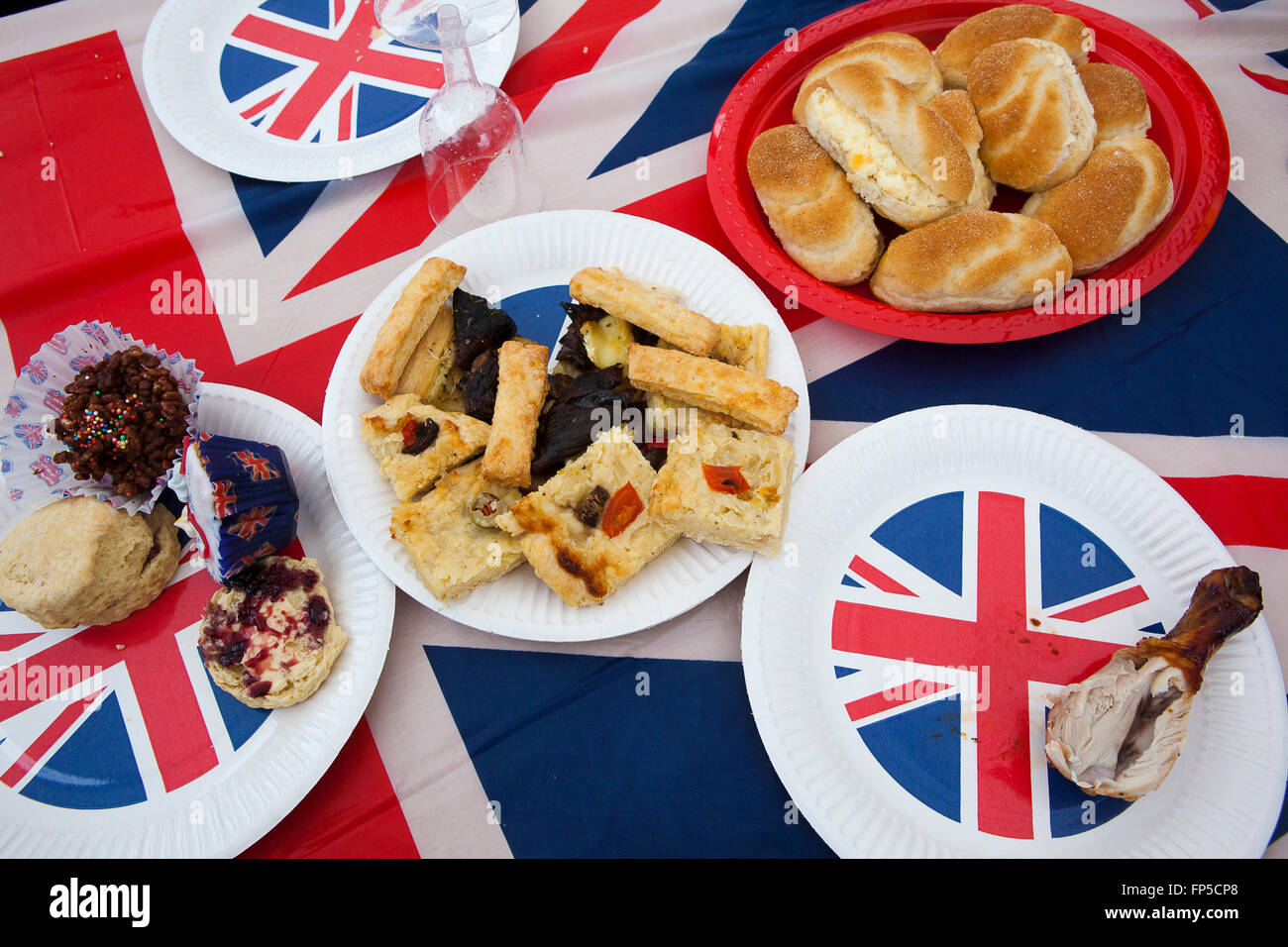 The Queen of England's Dimaond Jubilee and a street party and left over food adorn tables set up by residents. Stock Photo