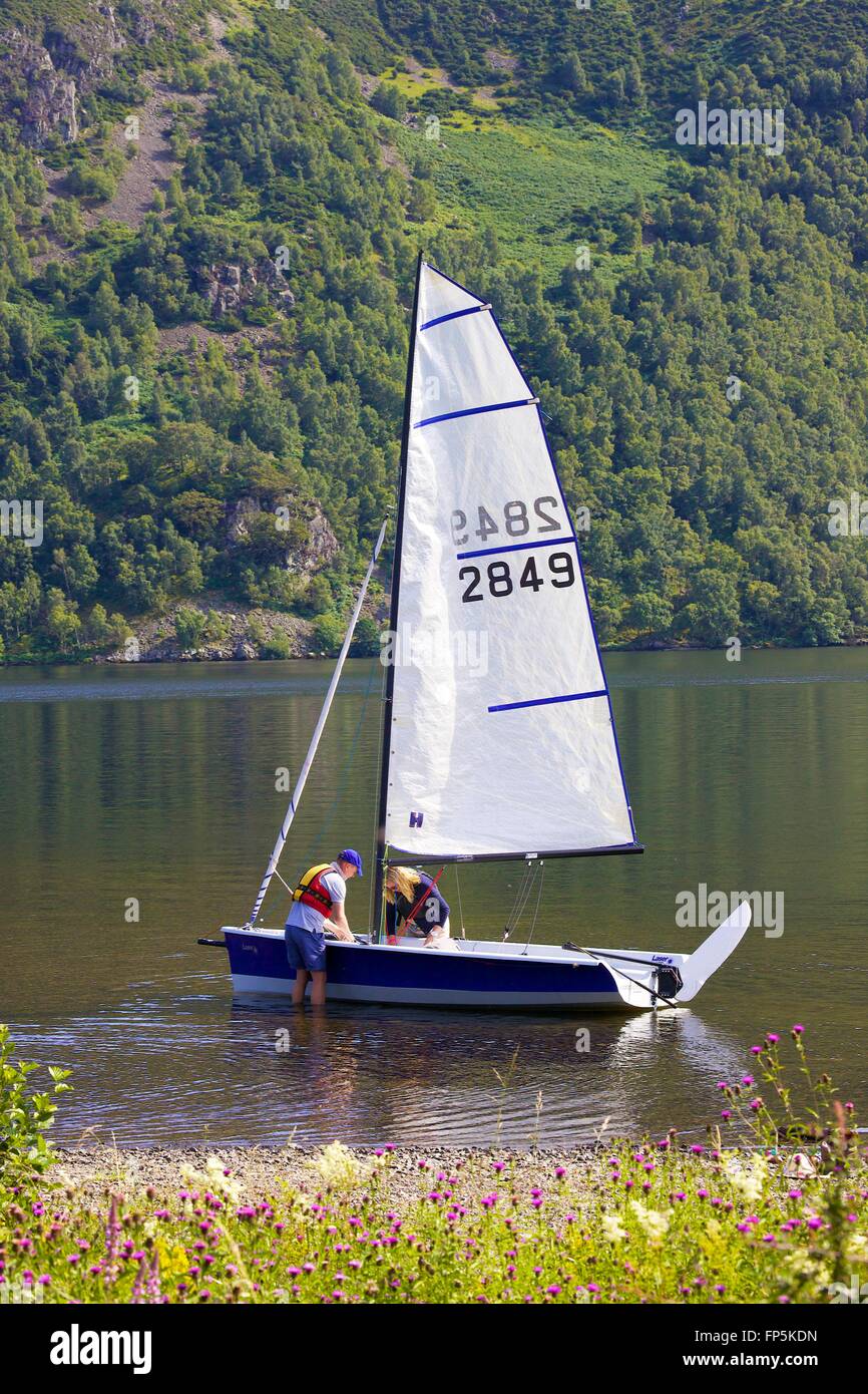 Lake District National Park. Couple dinghy sailing on lake. Aira Force