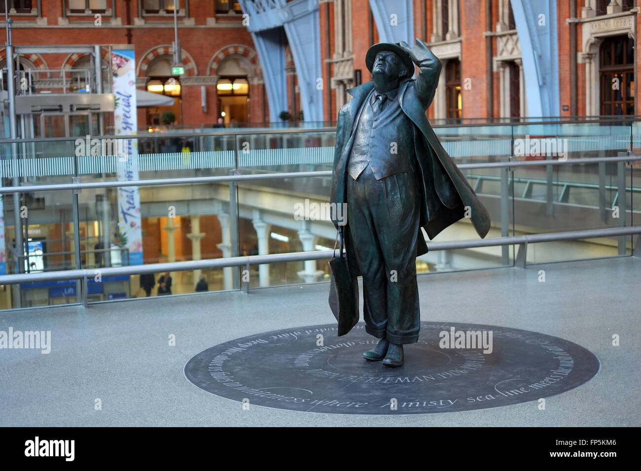 A statue of the poet Sir John Betjeman at St. Pancras International Railway Station in London, England, United Kingdom, Europe. Stock Photo