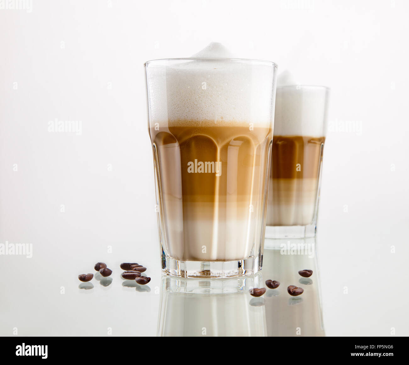 https://c8.alamy.com/comp/FP5NG6/latte-macchiato-coffee-in-a-glass-isolated-on-white-background-FP5NG6.jpg