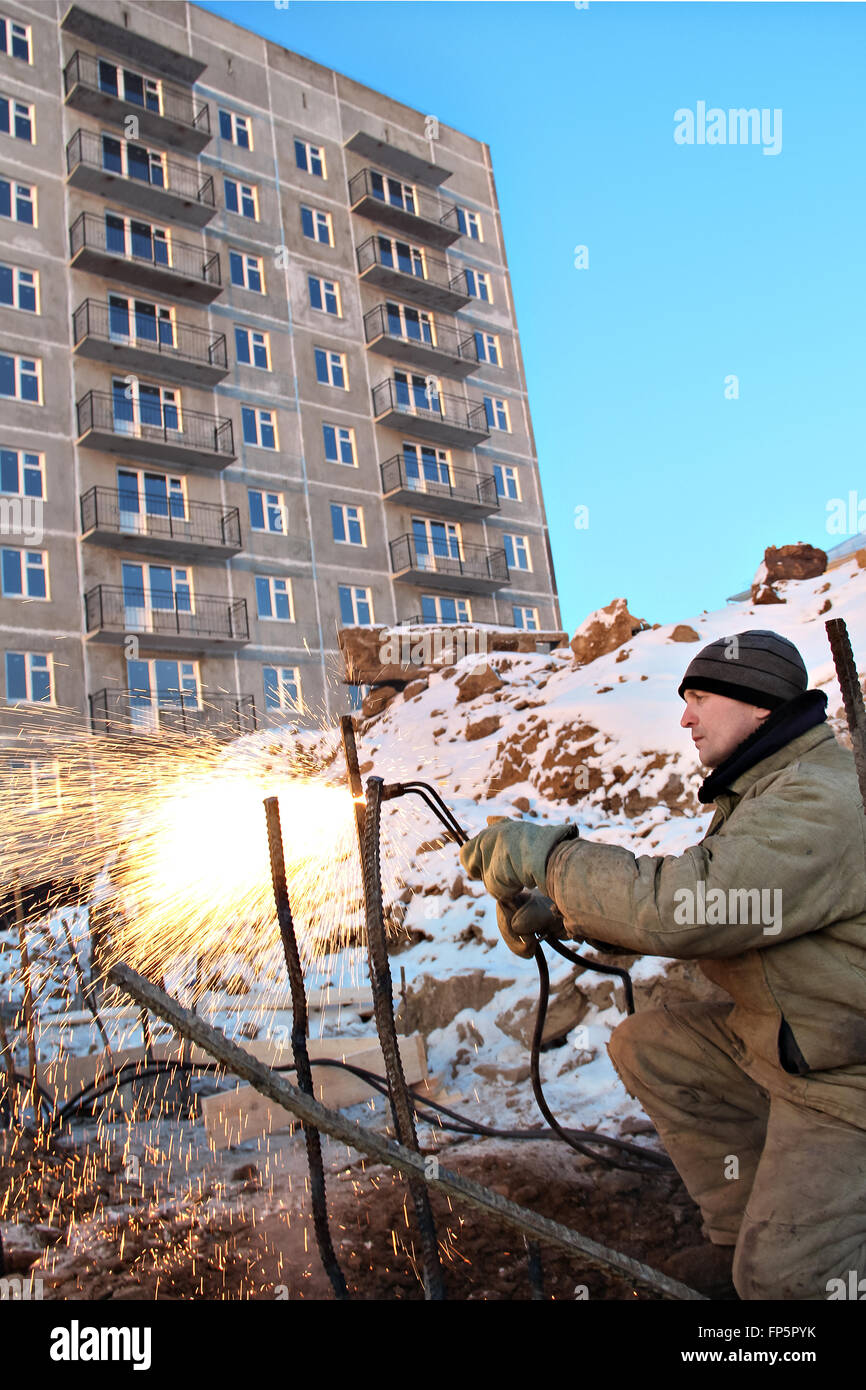 The welding worker in the construction site making reinforcement metal ...