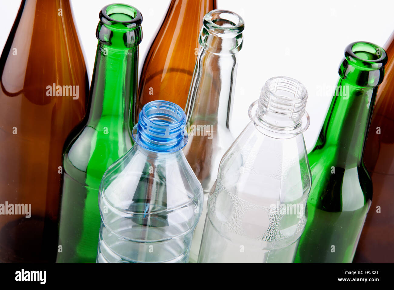 Empty bottles close-up isolated on white background Stock Photo - Alamy