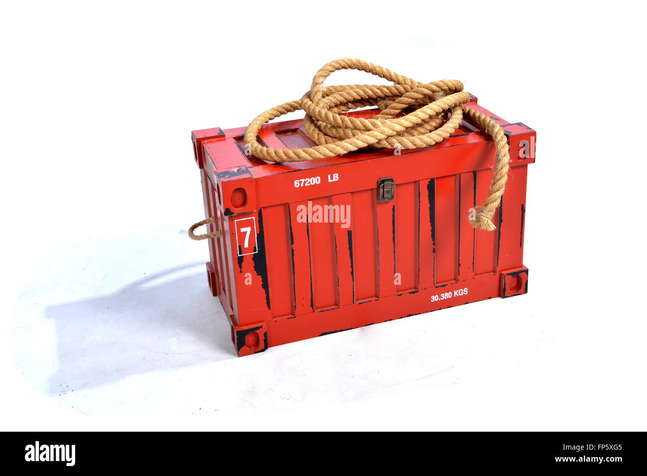 Red Shipping Container with Rope on White Background. Stock Photo