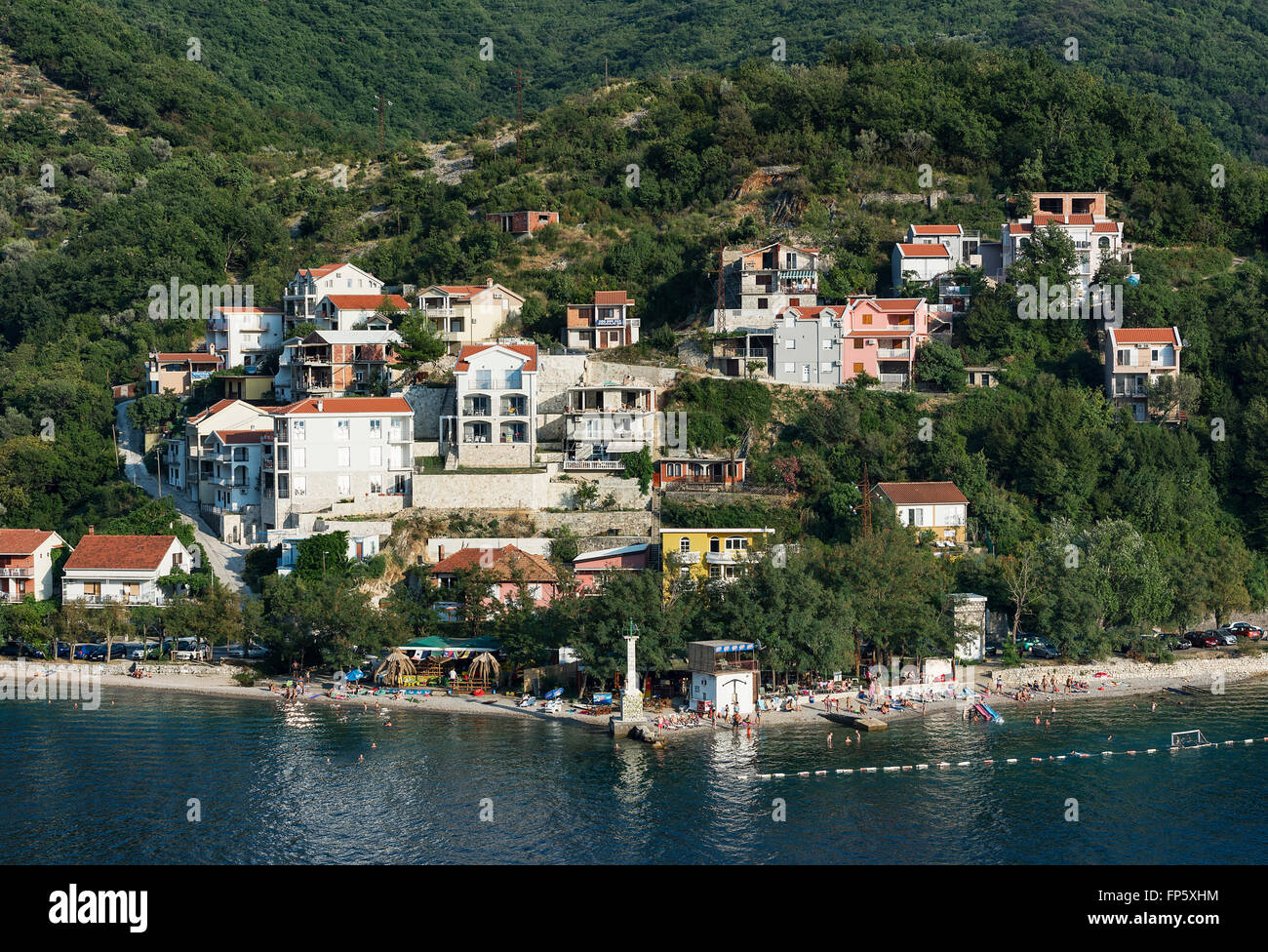 Beach and houses in village of Lepetane, Bay of Kotor, Montenegro Stock Photo