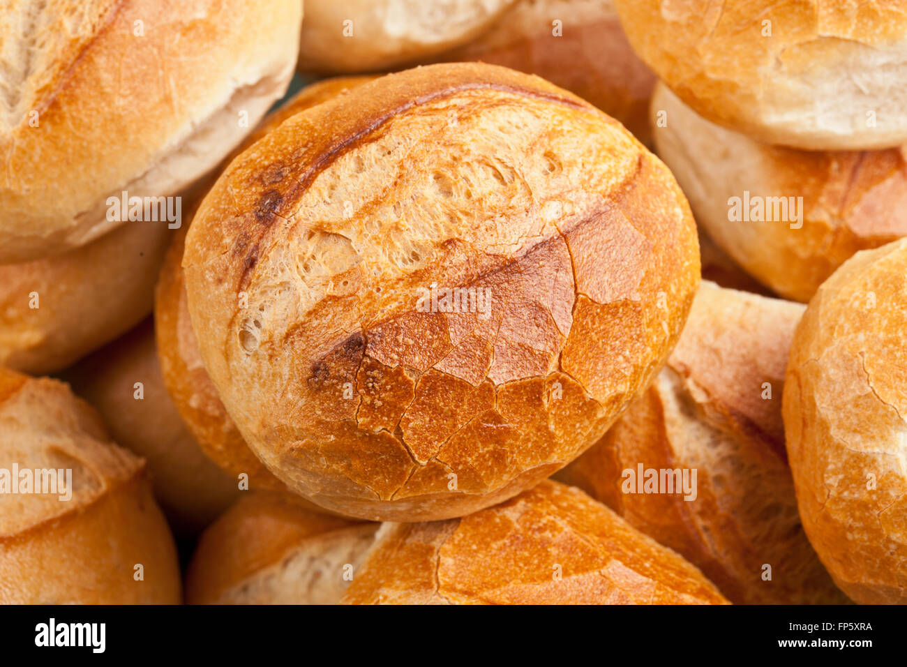 Plenty of fresh bread rolls or bun on white background in a german bakery Stock Photo