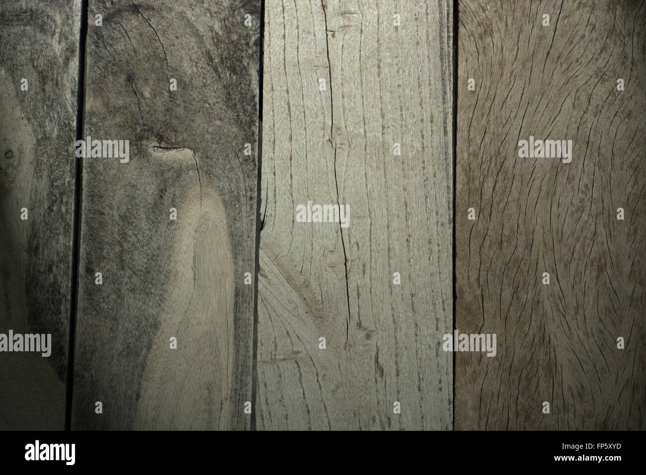 Rustic weathered barn wood background with knots and nail holes. Stock Photo