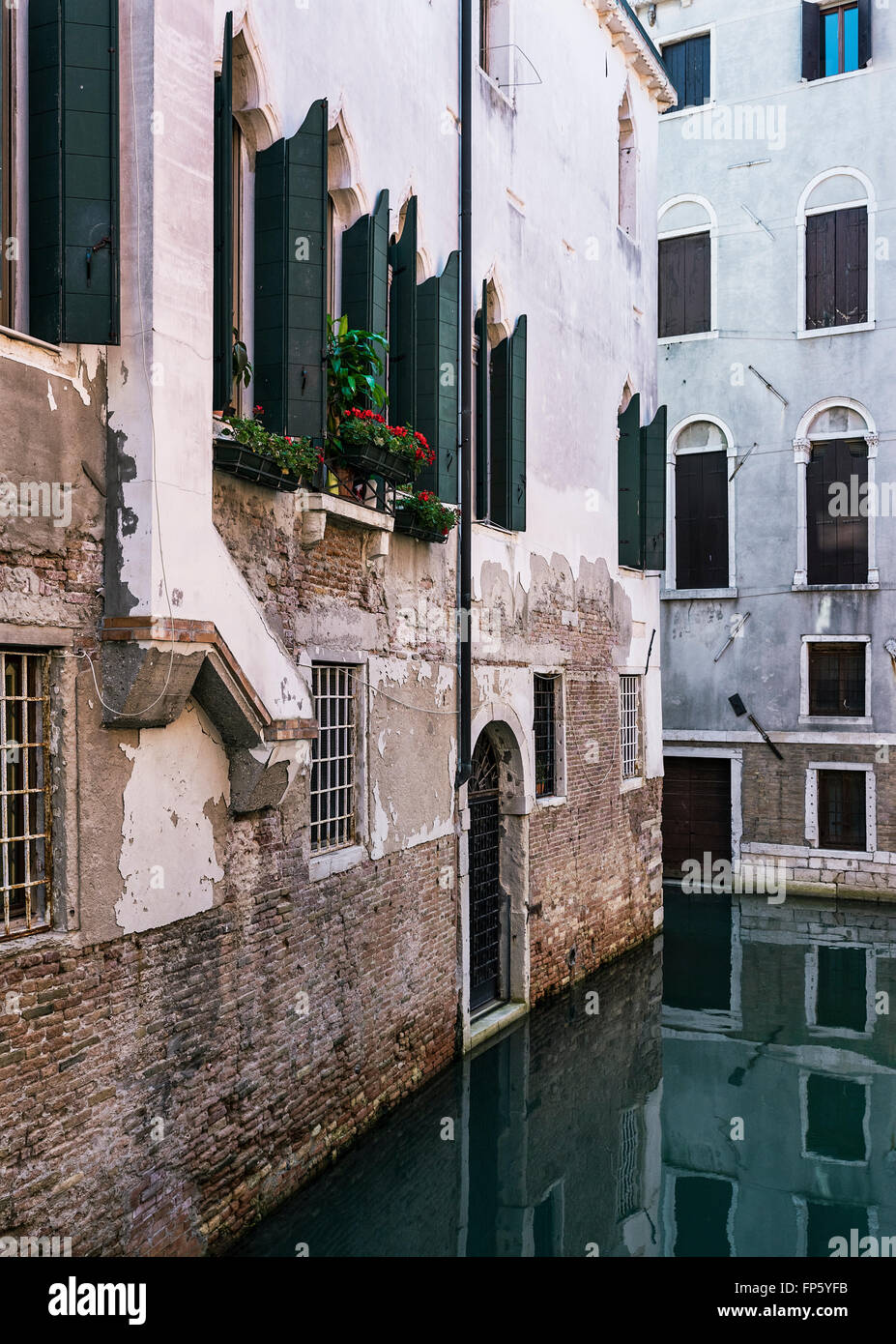 Quiet canal and rustic apartments, Venice, Italy Stock Photo