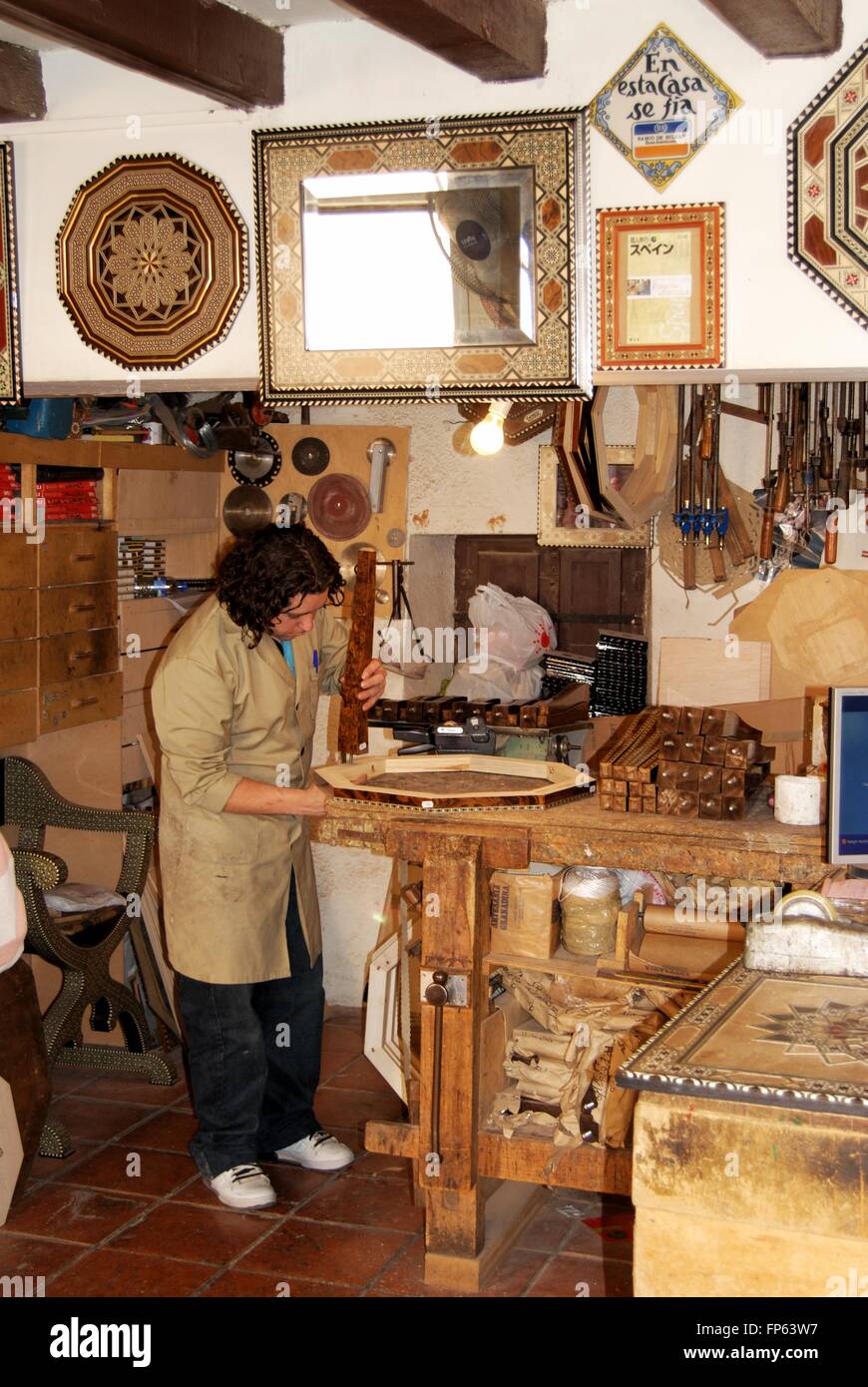A carpenter making Moroccan style furniture inside a Palace